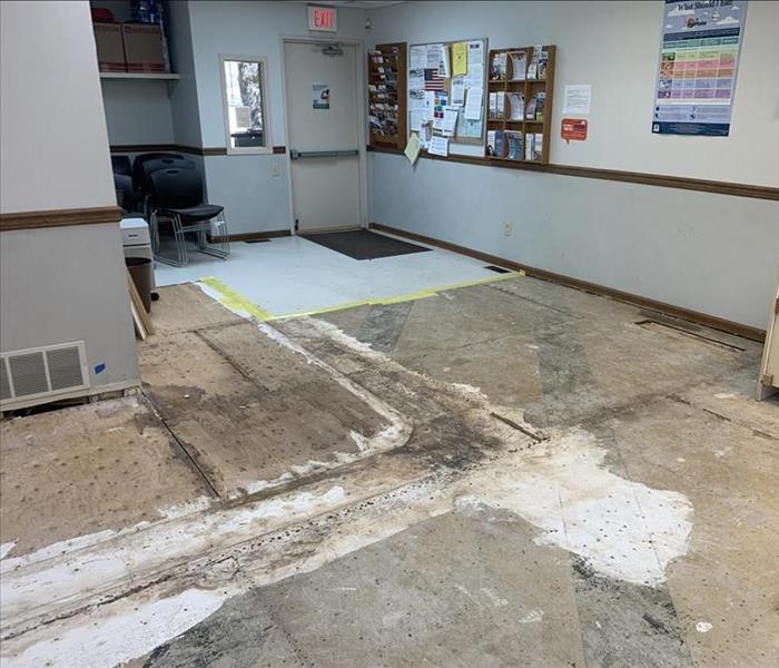Exposed sub-floor after water loss