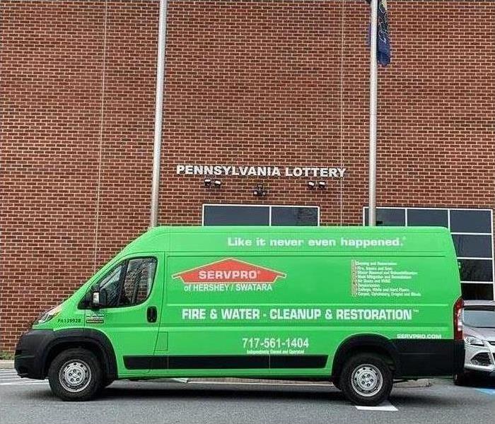 SERVPRO van parked in front of a commercial building