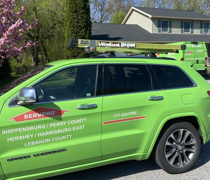 SERVPRO Company vehicle parked in front of a house