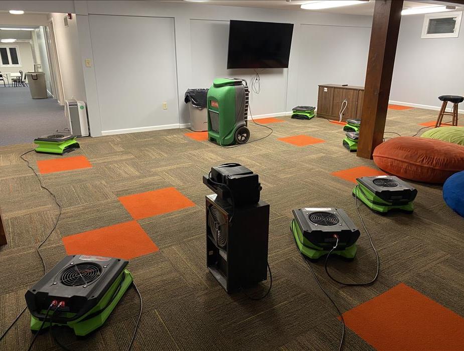 Dehumidifiers and Air Movers drying out carpet