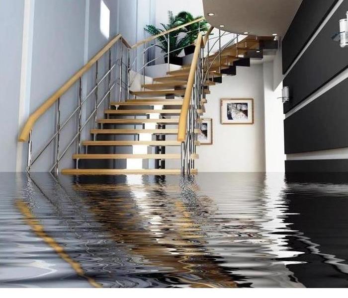 Spiral staircase leading down to a room full of water 