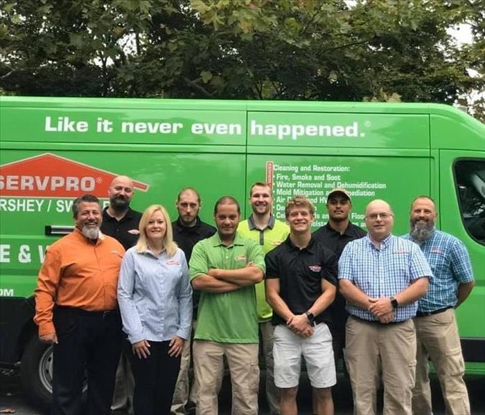 SERVPRO of Shippensburg / Perry County Staff in front of a SERVPRO van
